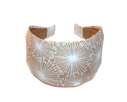 Fabric headband with white geometric pattern on a white background